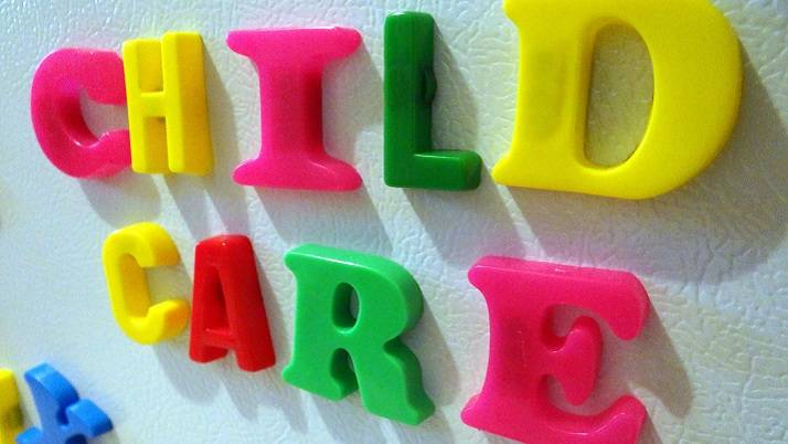 Child Care spelt out with children's magnetic letters
