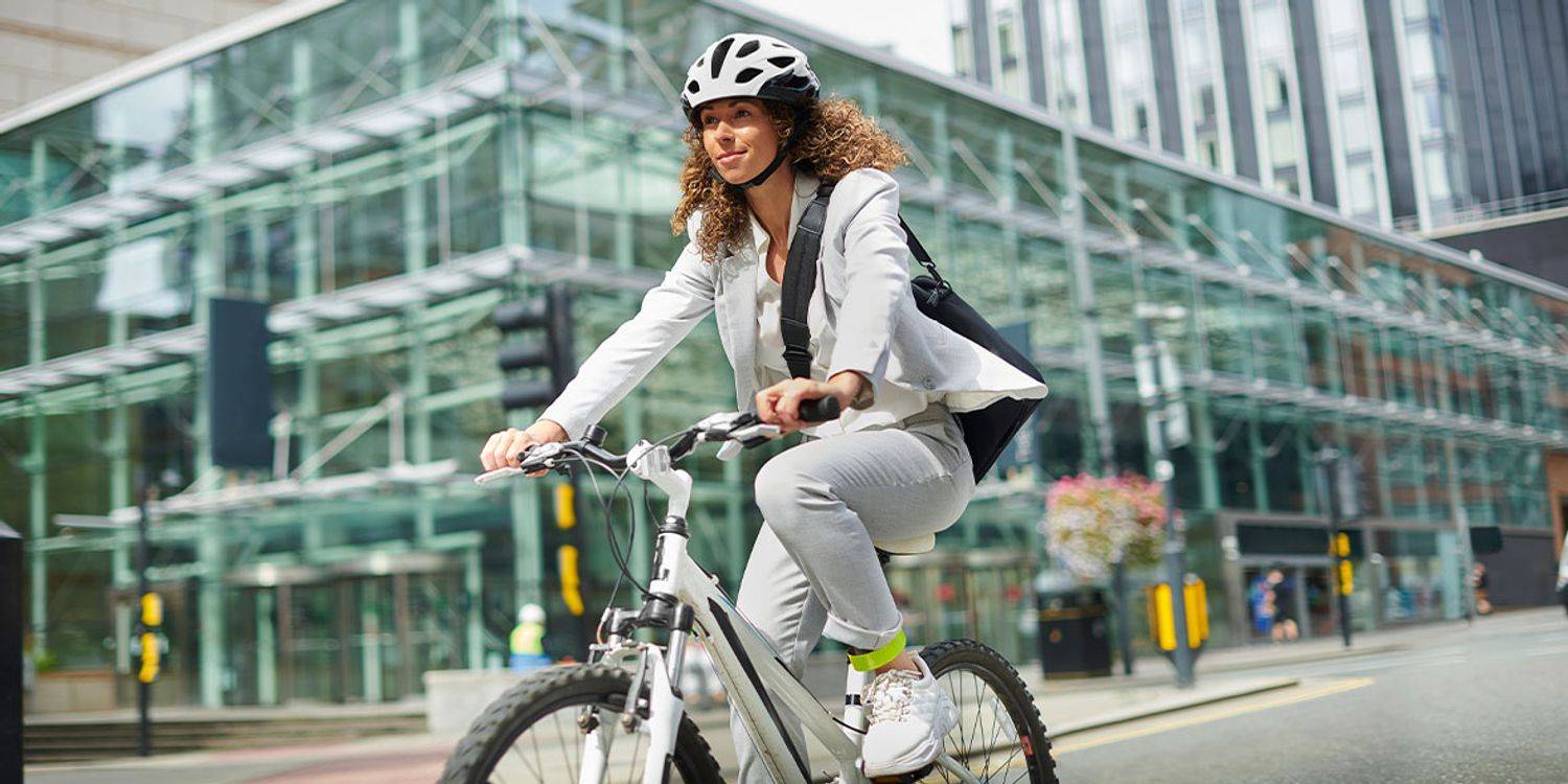 A young office worker on her bike in the city