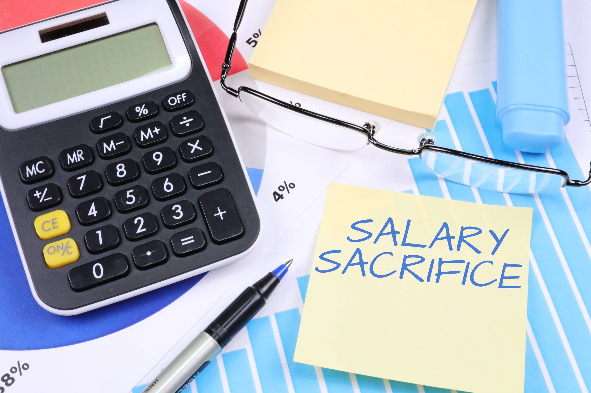 Salary Sacrifice written on a post-it next to a calculator